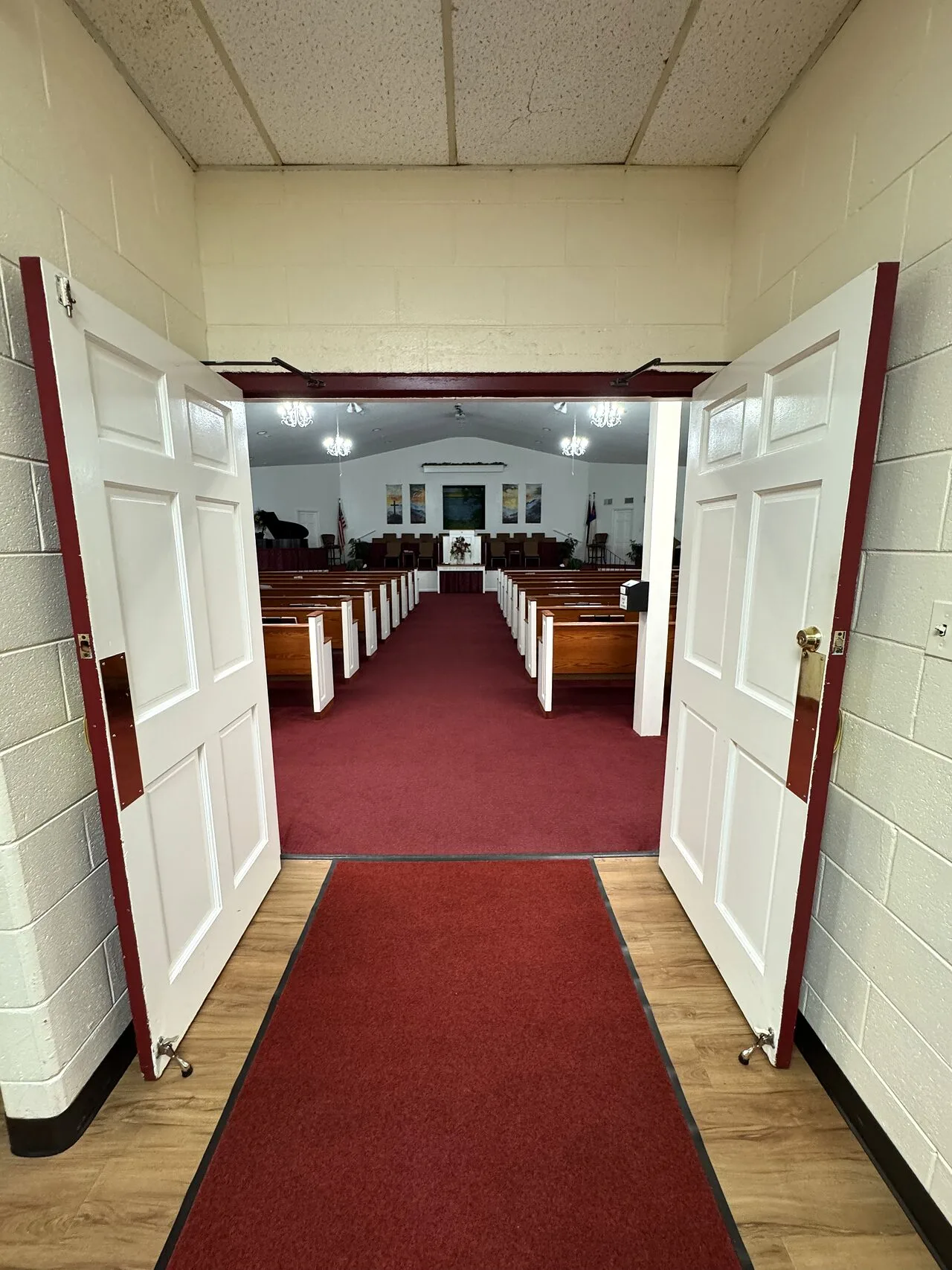 The center aisle leading toward the platform inside Grace Baptist Church